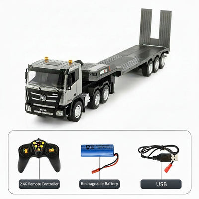 Toy truck with flatbed, remote control, battery, and USB cable on a white background